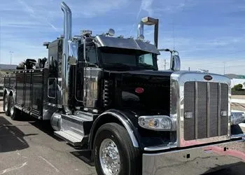 a black truck with a large exhaust pipe